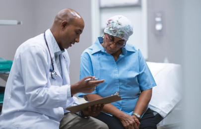 Doctor and patient review paperwork