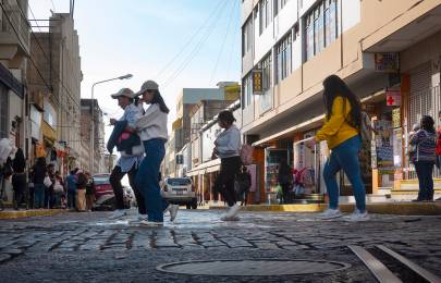 Four women crossing a city street