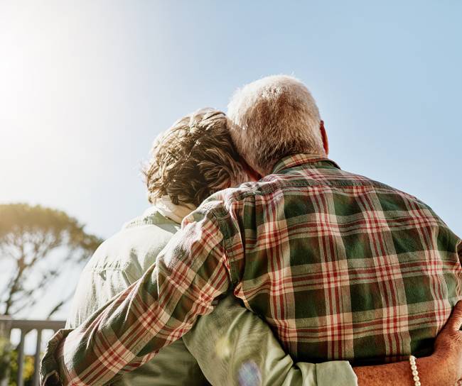 senior couple hugging each other