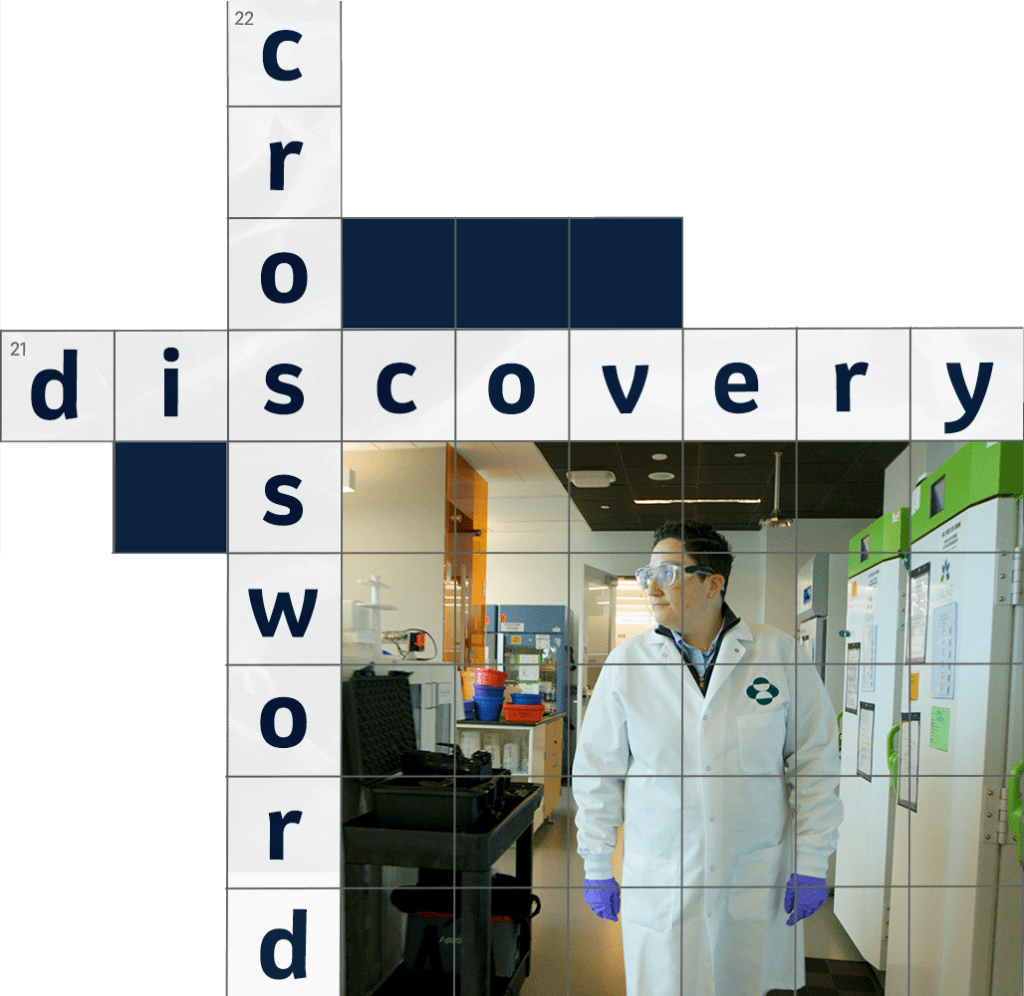 illustration of a section of a crossword puzzle with the words "crossword" and "discovery" intersecting. There's also a photo of scientist Rebecca Goldstein wearing a lab coat.